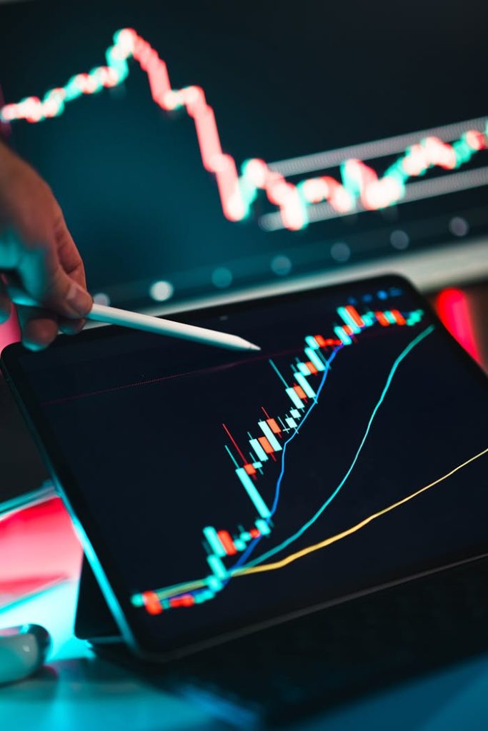 analyzing-trading-data-on-digital-tablet-30572289 Close-up of cryptocurrency trading analysis on a digital tablet, highlighting market trends.